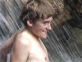 Luke gets a little wet under the waterfall at Gordale Scar